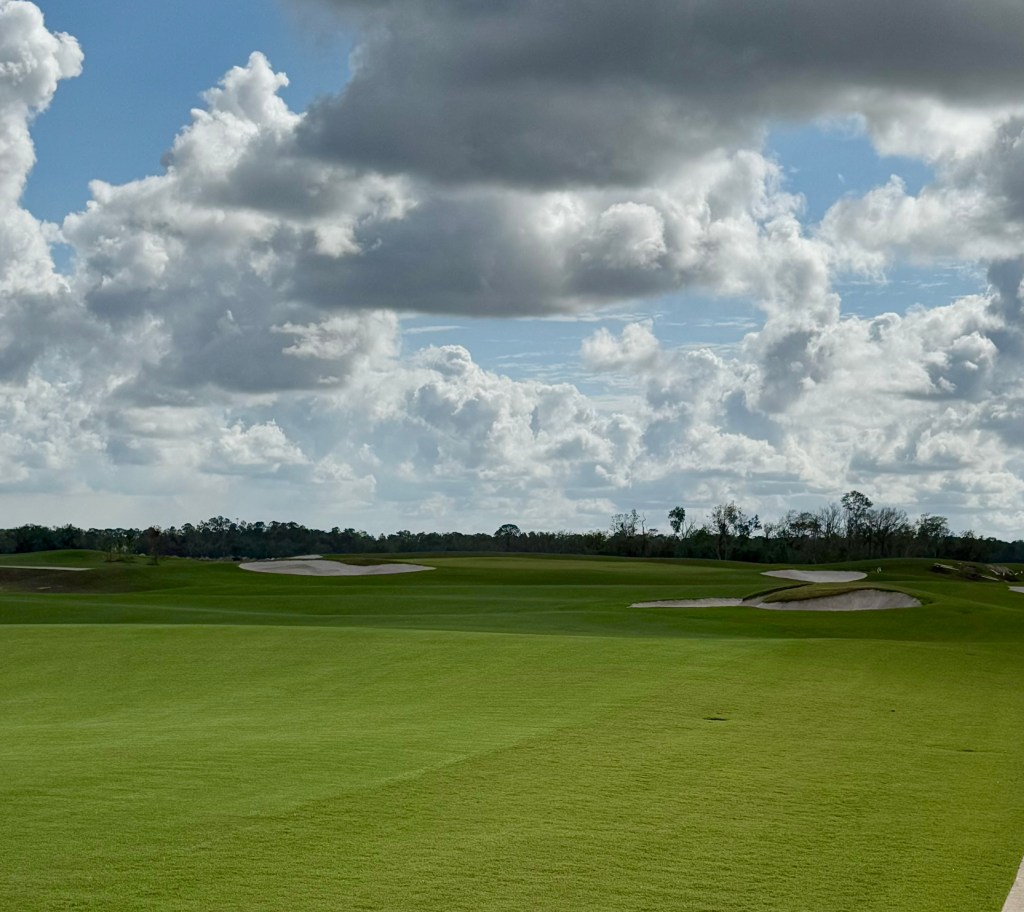 A cloudy day at the course, vibrant greens fill the landscape.
